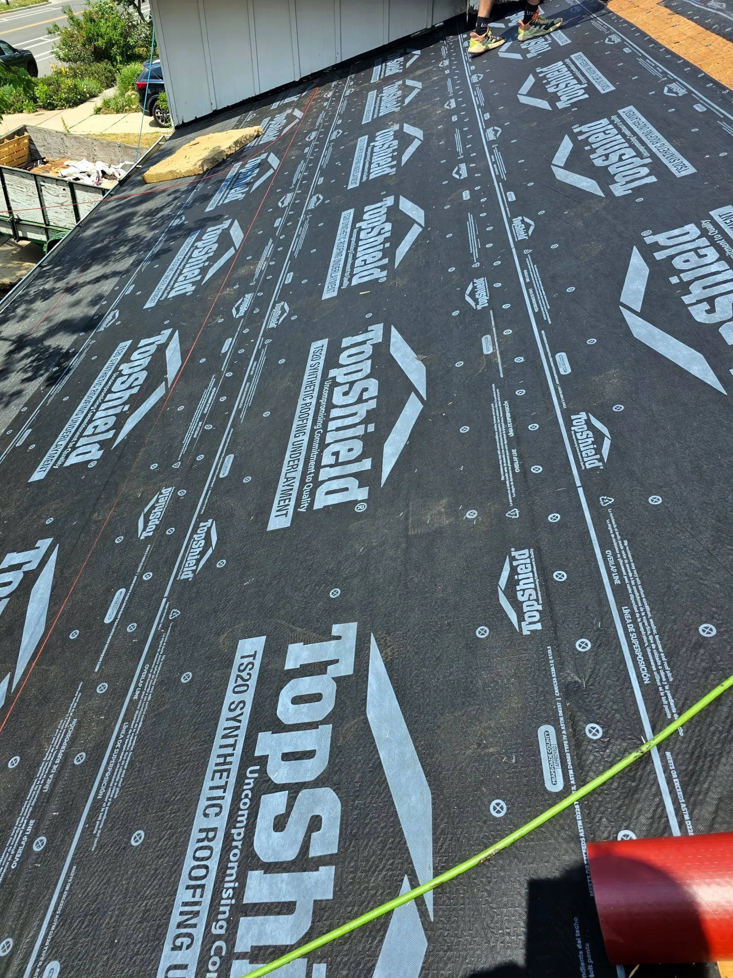 Roof covered in new synthetic underlayment before shingles